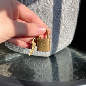 Authentic Louis Vuitton gold padlock number 322